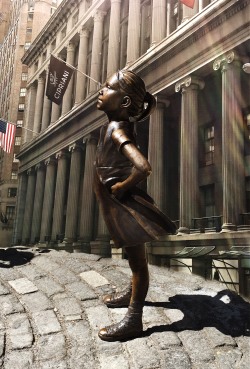 The little girl staring down the Wall Street Bull.