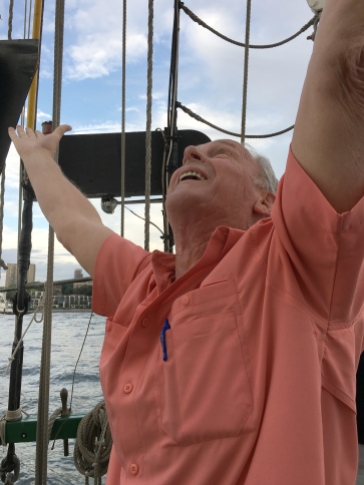 Celebrating the hoisting of the sails! - Photo by Joyce Wright
