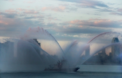 FDNY Water boats spewed colored streams of water in the East River